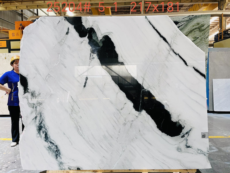 Raw Panda White marble slab with striking black veins. Raw Panda White marble slab with striking black veins.