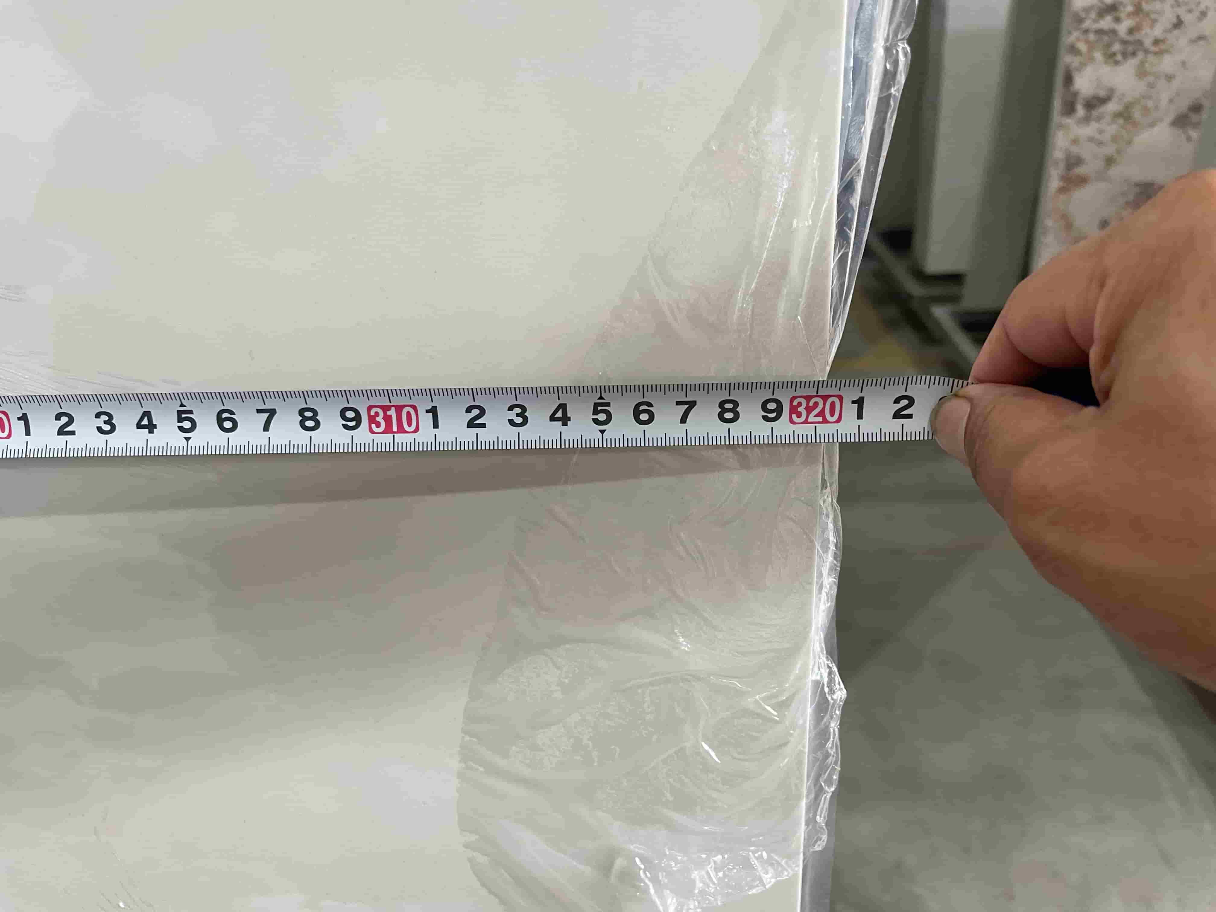 Hetian White Jade sintered stone slab length measurement before shipment