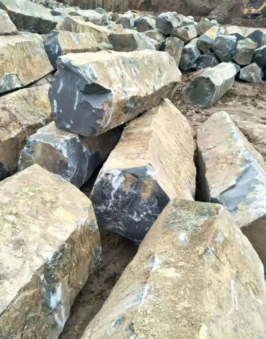 Mongolian Black Granite Blocks Before Processing Mongolian Black basalt blocks awaiting cutting and fabrication at the factory