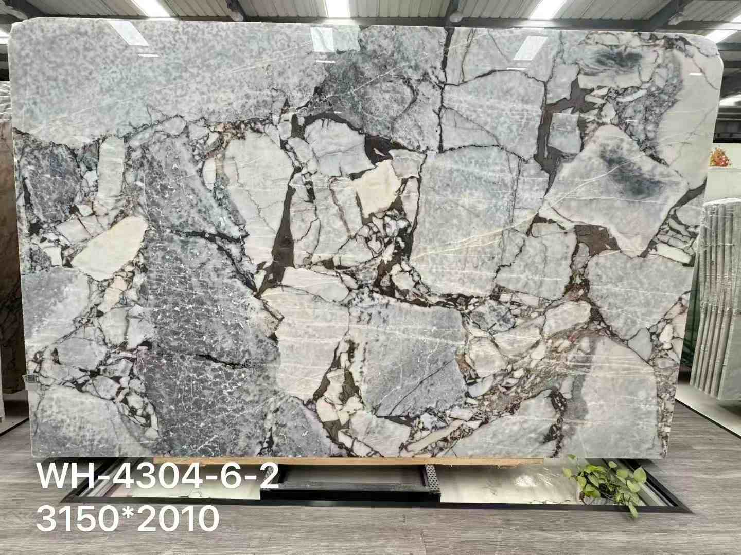 Chinese Calacatta Viola Elephant White marble slab with cool grey-green breccia and large pale mineral fields