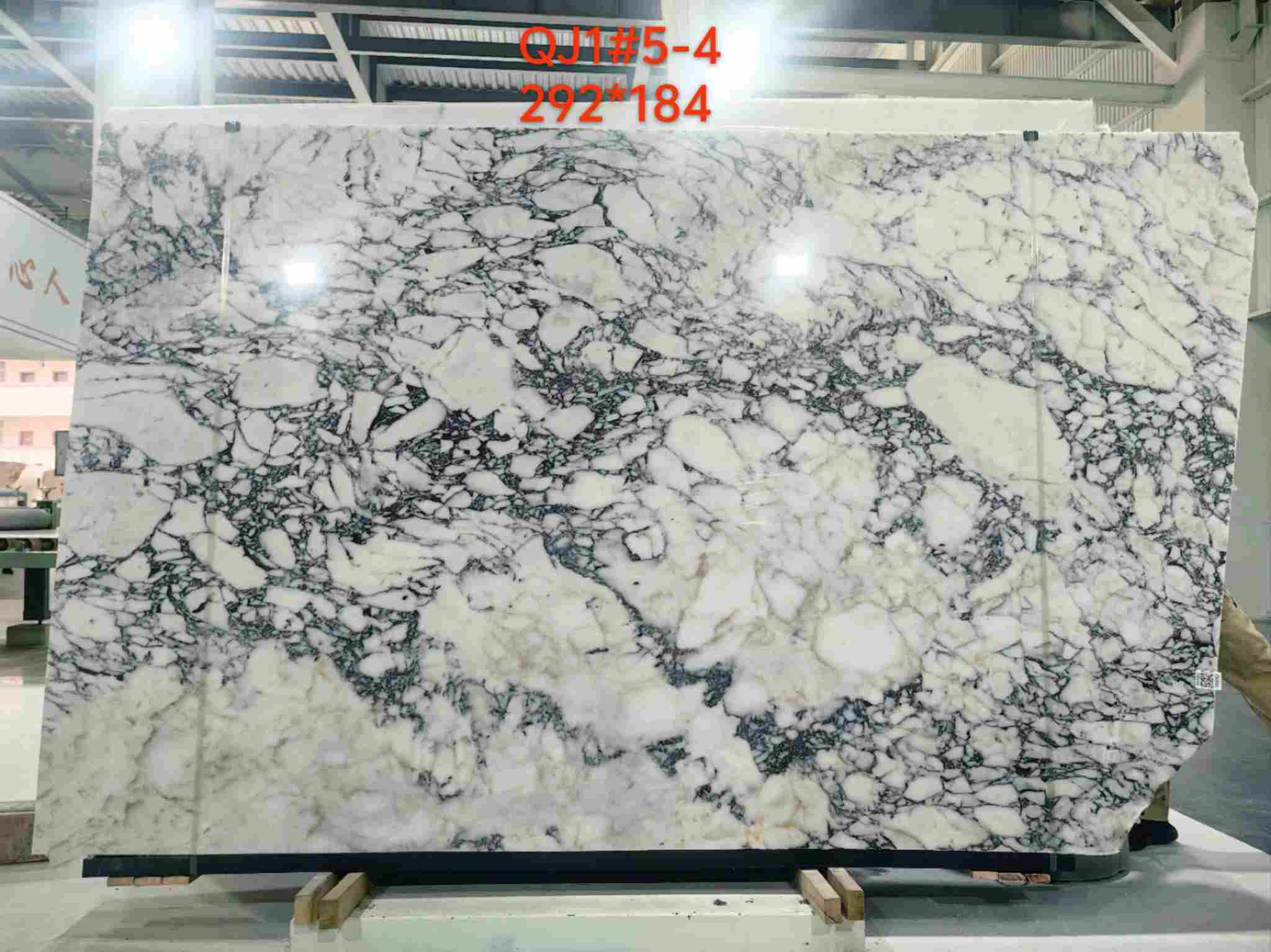 Turkish Calacatta Viola marble slabs with lower-saturation burgundy tones and creamy-white breccia
