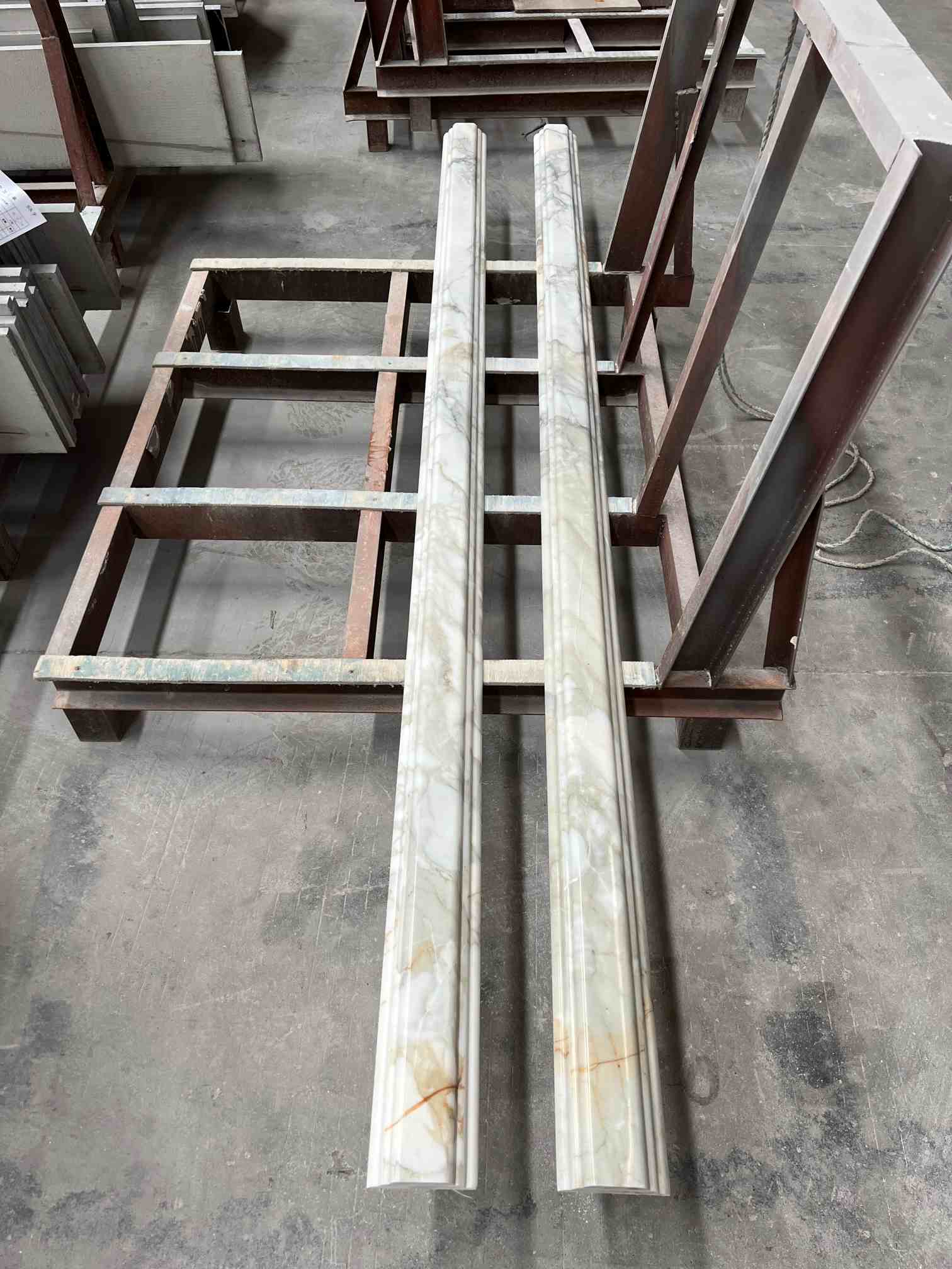 Cut-to-size Calacatta White marble trim with a custom shaped profile