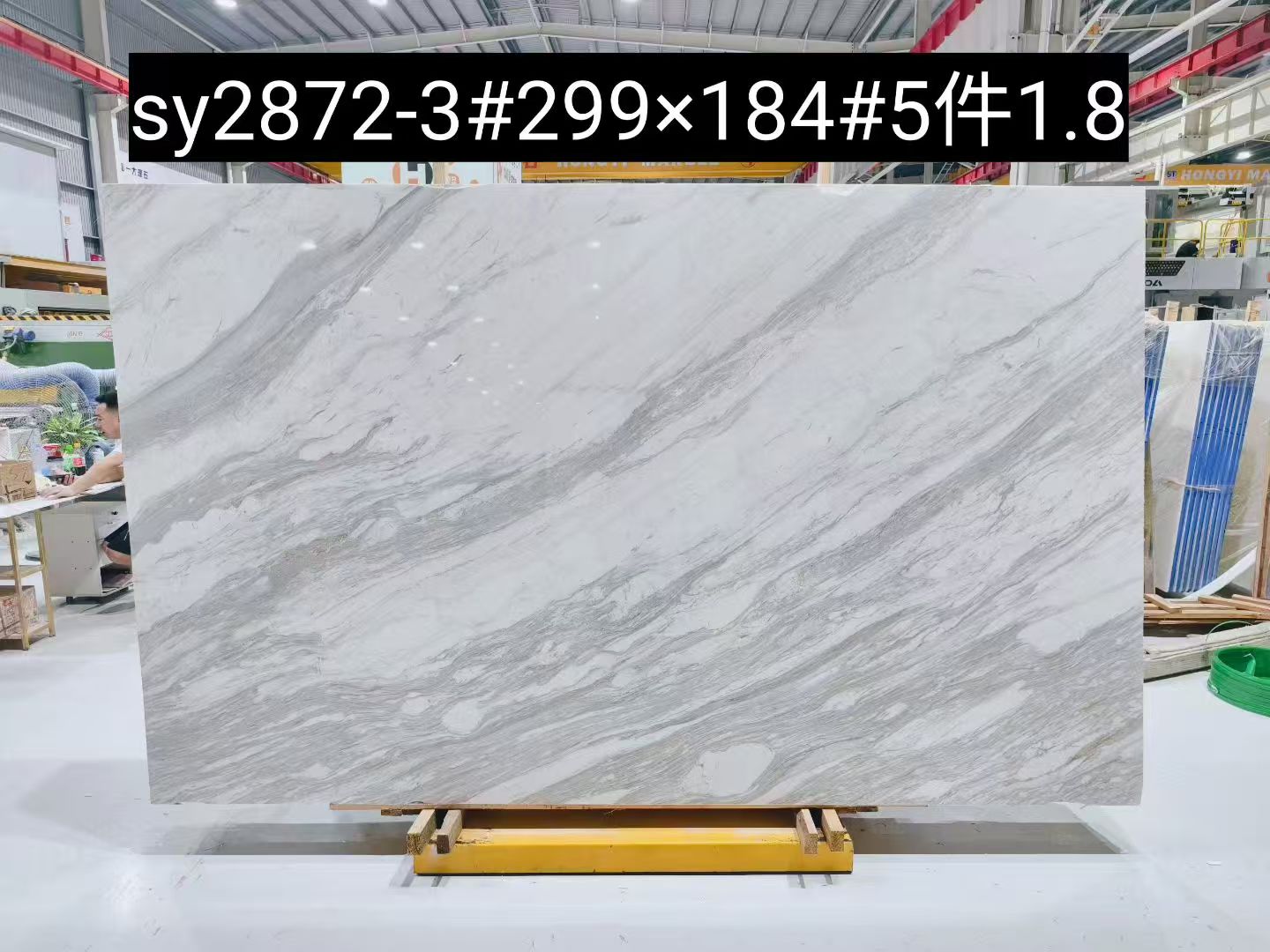 Spider Volakas marble slab with layered diagonal grey veining and rich natural movement