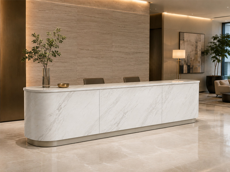 Volakas Marble Reception Desk Commercial Application Volakas marble curved reception desk shown in a commercial interior application
