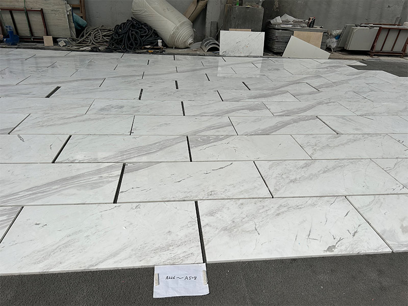 Volakas marble tiles pre-laid at the factory for batch color and vein review