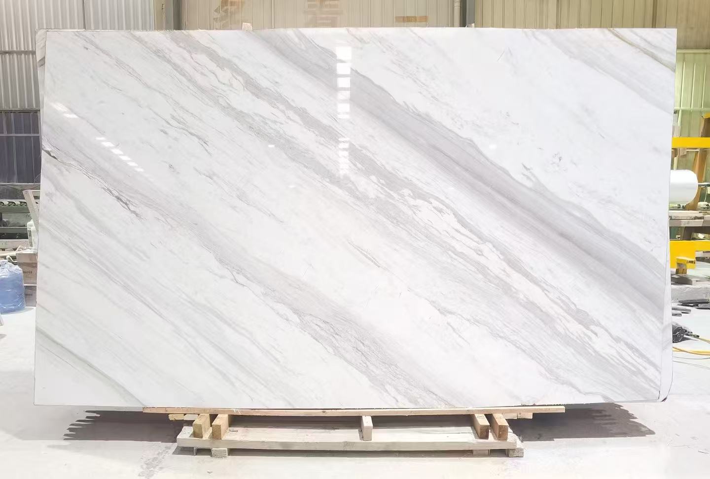 JPAPA Volakas marble slab with bright white background and long orderly grey veins