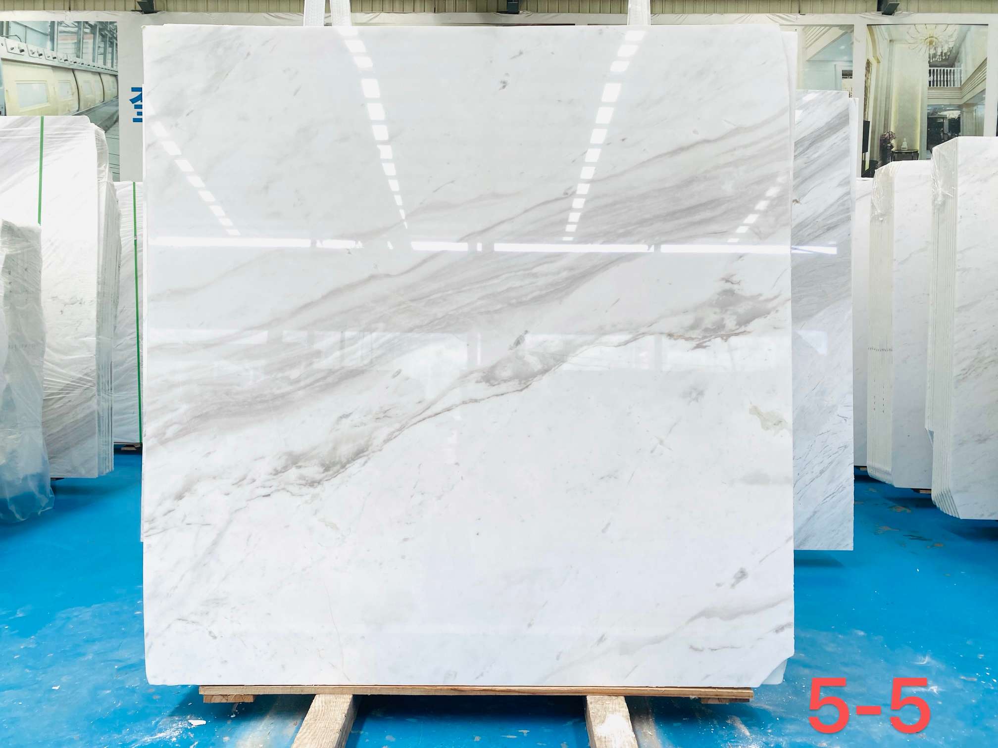 Dionyso Volakas marble slab with bright white background and a soft flowing grey vein