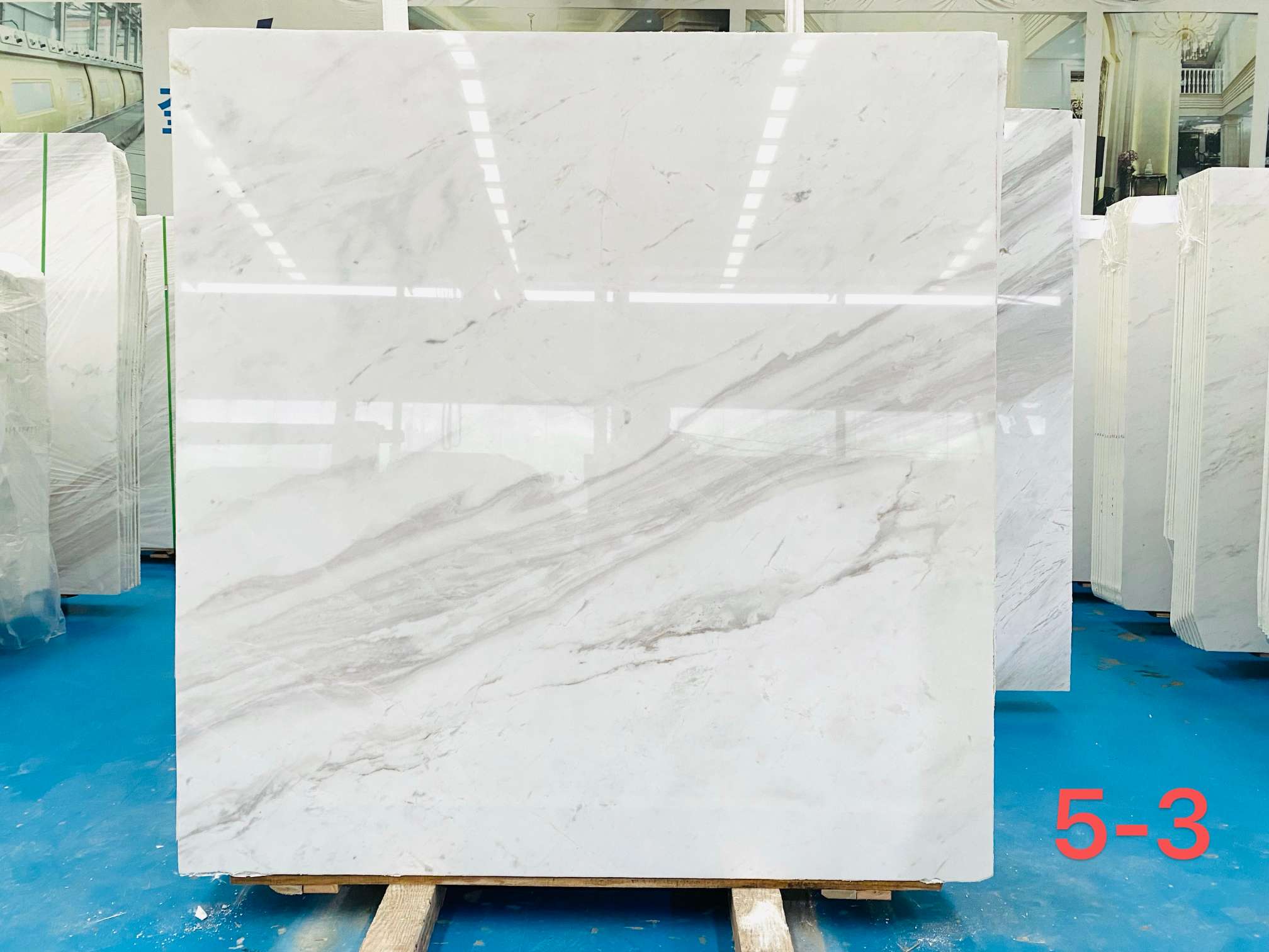 Dionyso Volakas marble slab with open white background and one flowing diagonal grey vein