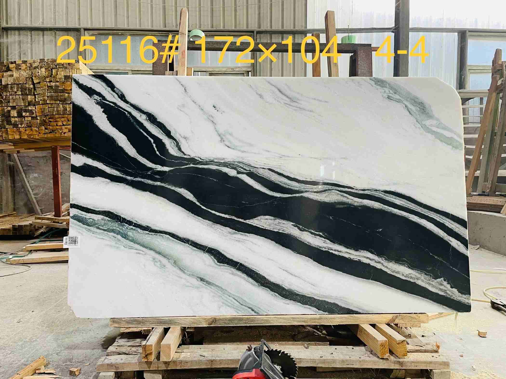 Natural Panda White Marble slab with dense dramatic black veins across a white background