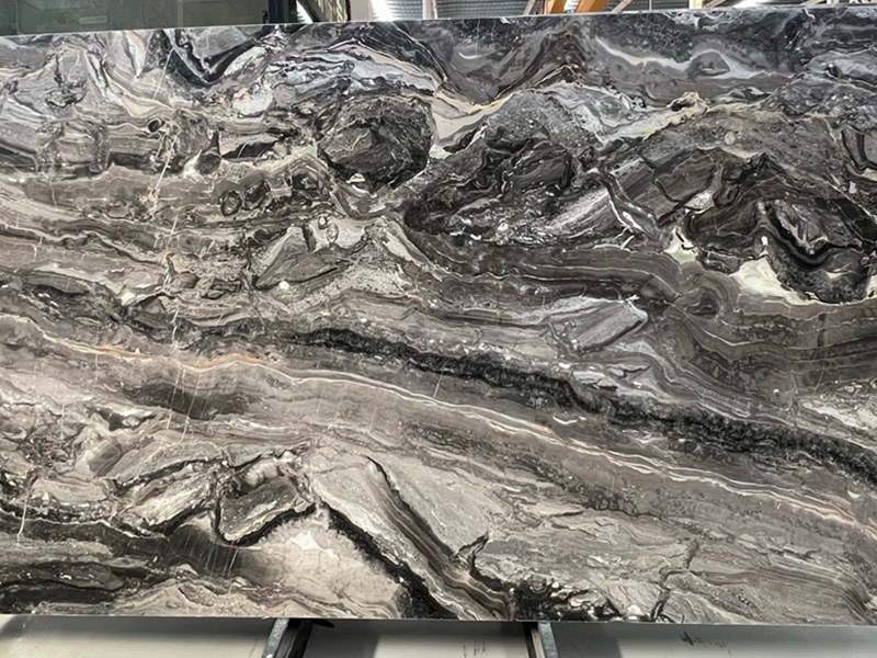 Ariana Silk Marble slab with sweeping curved bands for directional wall panel layout