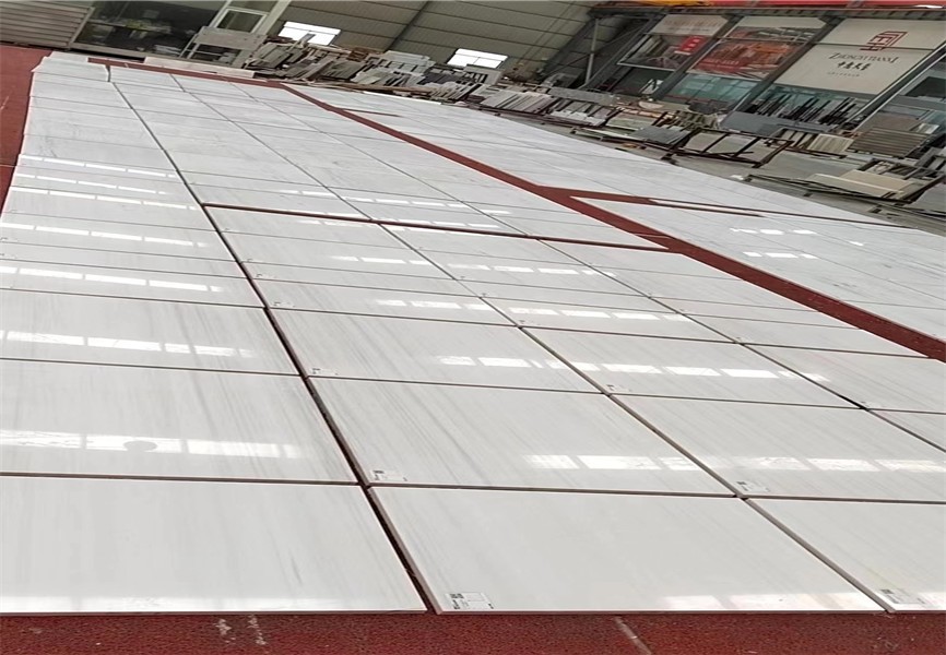 Bianco Dolomiti White Marble tiles arranged in a large layout
