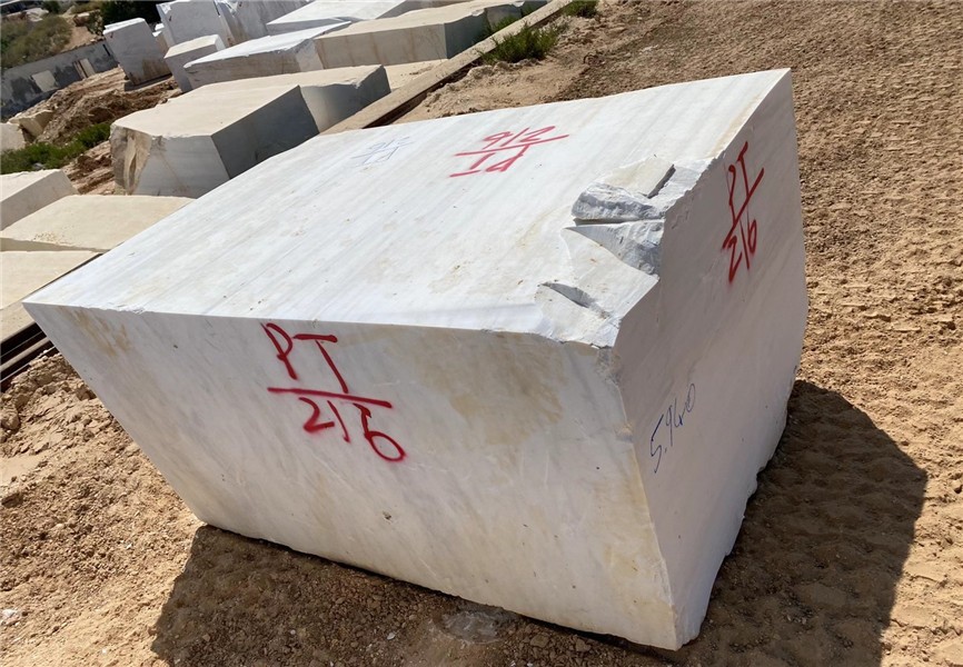 Bianco Dolomiti White Marble block in an outdoor stone yard