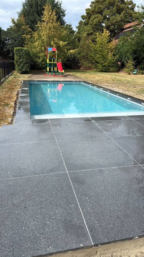Cambodia G654 granite poolside paving and pool coping installed in Belgium