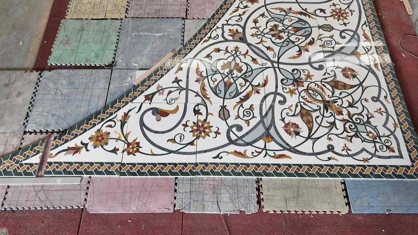 Triangular corner marble inlay with intricate floral pattern and decorative border
