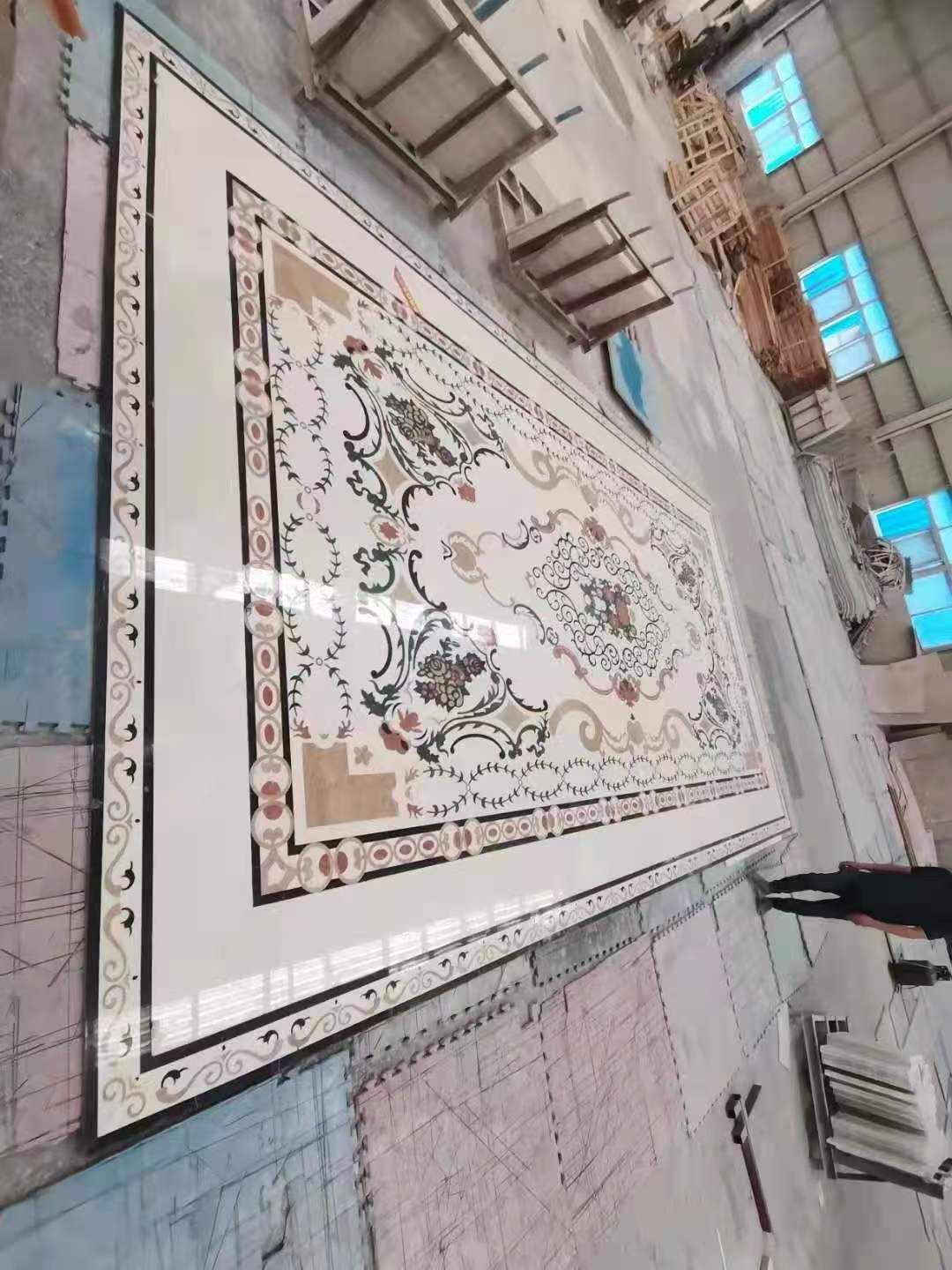 Large rectangular full-floor marble inlay with borders and central floral arrangement